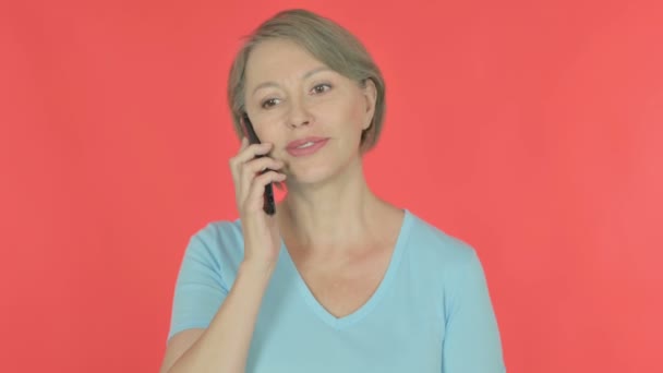 Senior Old Woman Talking Phone Red Background — Video Stock