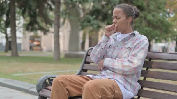 Young African Woman Coughing While Sitting Bench Outdoor — Stok video