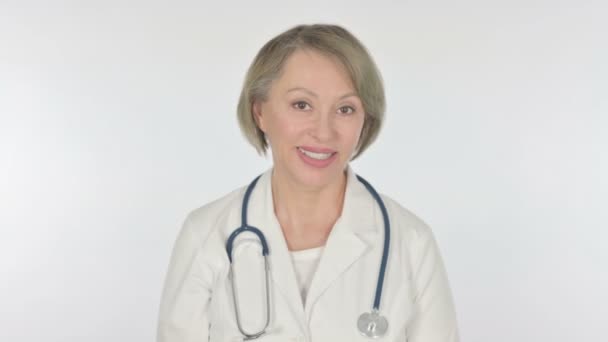 Senior Female Doctor Talking Online Video Call White Background — Vídeo de Stock