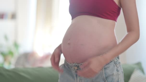 Pregnant Young Woman Stokes Her Big Belly Close — Video Stock