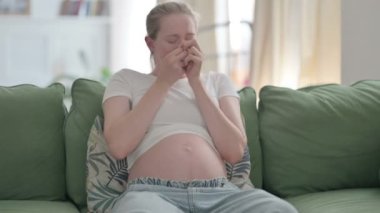 Sick Pregnant Young Woman Feeling uncomfortable while Coughing and Having Flu