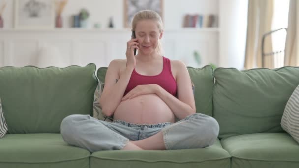 Pregnant Young Woman Talking Phone While Relaxing Sofa — Video Stock