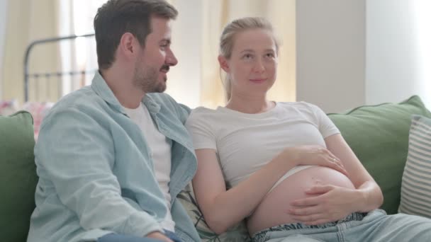 Talking Pregnant Young Couple Relaxing Home Discussing Future — Video Stock