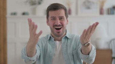 Portrait of Tense Casual Man Reacting to Loss