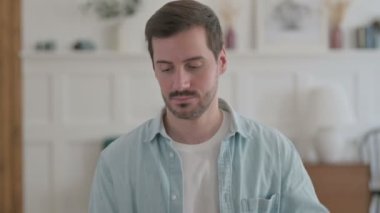 Portrait of Casual Man having Neck Pain 