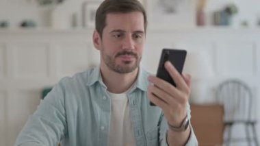 Casual Man Talking on Phone, Discussing Work