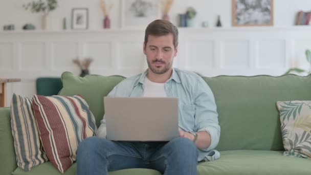 Casual Man Thinking While Working Laptop Sofa — Vídeo de Stock