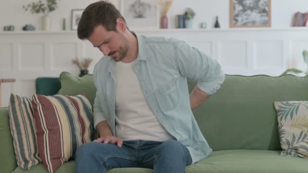 Casual Man Having Neck Pain While Sitting Sofa — Stockvideo