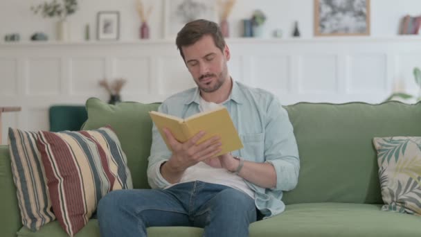Casual Man Reading Book While Sitting Office — Video