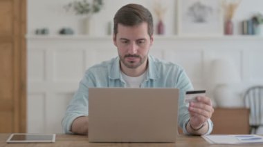 Happy Casual Man Shopping Online on Laptop 