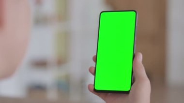 Close Up of Female Hand using Smartphone with Green Screen 