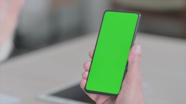 Close Up of Senior Old Man Using Smartphone with Green Screen