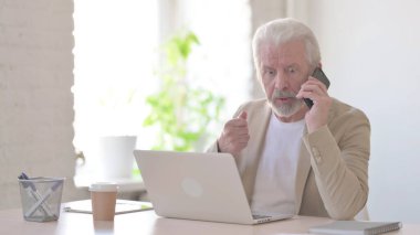 Angry Senior Old Man Talking on Phone