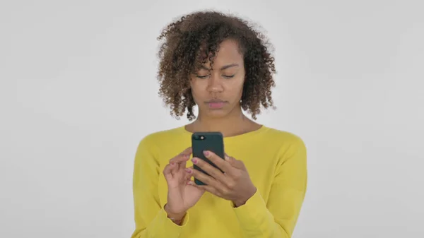 African Woman Browsing Smartphone White Background — 스톡 사진