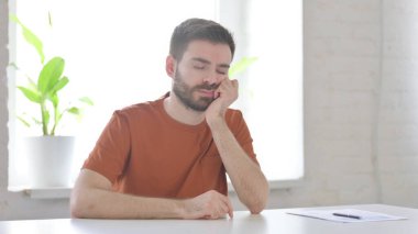Tired Creative Young Man Sleeping in Office