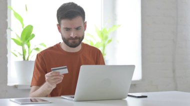 Creative Young Man Having Online Payment Problem on Laptop
