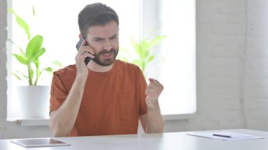 Angry Man Talking on Phone, Argument