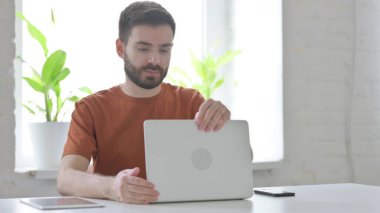 Creative Young Man Coming Back to Work in Office, Opening Laptop