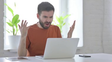 Creative Young Man Feeling Angry at Work