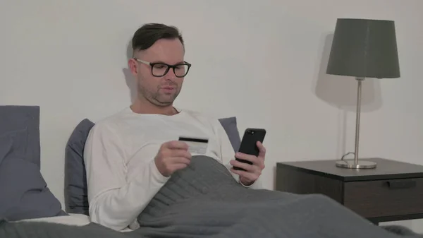 Middle Aged Man Making Online Payment Smartphone Bed — Stock Photo, Image