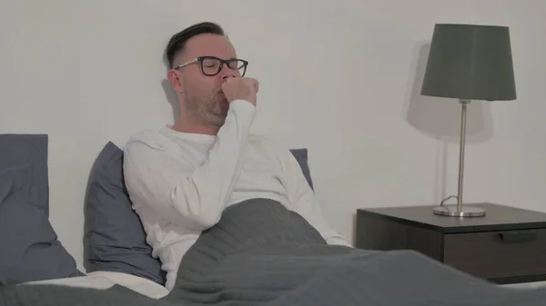 Middle Aged Man Coughing While Sitting Bed — Stock Fotó