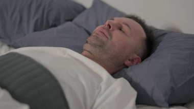 Close up Middle Aged Man Sleeping in Bed Peacefully