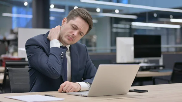 Young Businessman Having Neck Pain While Using Laptop Office — Stock Photo, Image