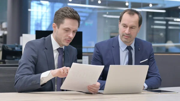 Two Businessmen Working Laptop Documents Office — Zdjęcie stockowe