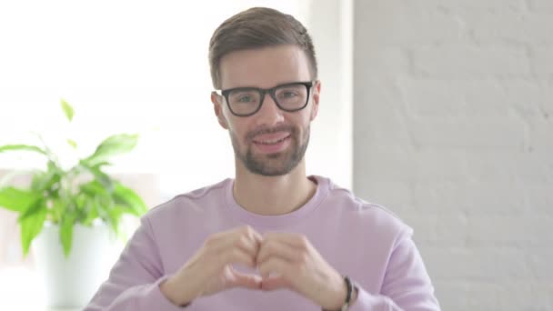 Portrait Young Adult Man Showing Heart Shape Hands — Stock Video