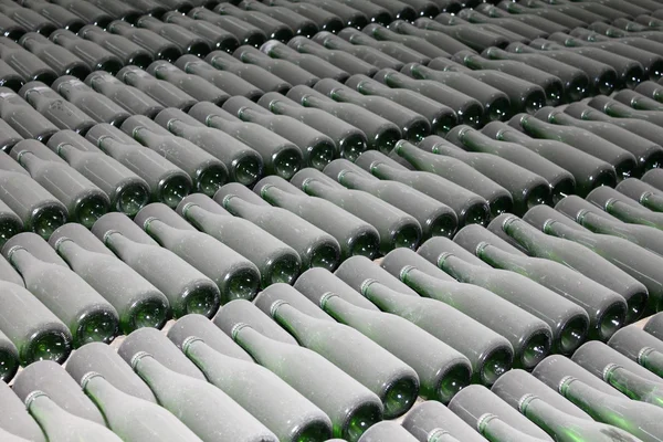 Stacked up wine bottles in the cellar — Stock Photo, Image