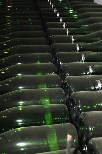 Stacked up wine bottles in the cellar — Stock Photo, Image