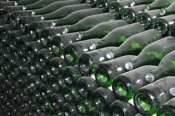 Stacked up wine bottles in the cellar — Stock Photo, Image