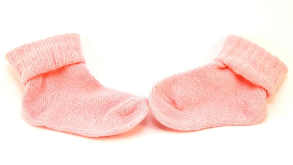 beyaz zemin üzerinde pembe çorap çifti