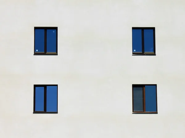 Wall of a modern house with four windows — Stock Photo, Image