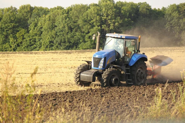 Modern tractor on the field — Stock Photo, Image