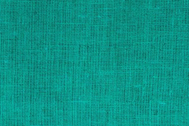 Yeşil bez kumaş, tuvalin üzerinde gerçek keten iplikler ve yeşil keten kumaş örnekleri gibi güzel keten dokular.