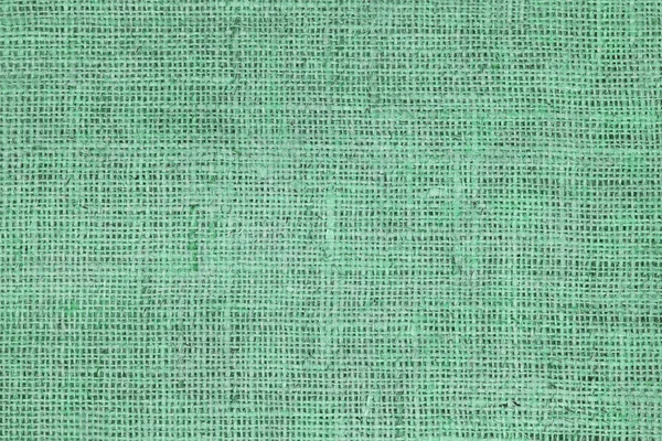 Green canvas texture with real linen threads on canvas with beautiful linen texture on canvas as sample of green linen canvas