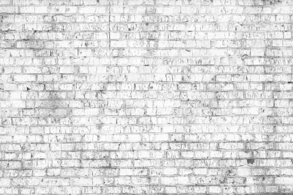 Brick wall with unusual white bricks made of whole white bricks and broken white bricks for an abstract white background