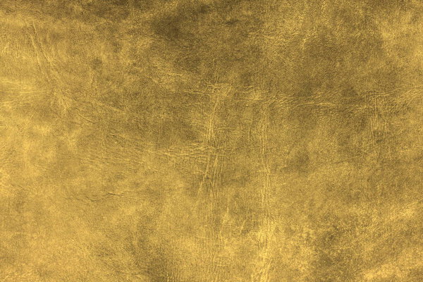 Красивый золотой фон с кожаной текстурой с золотыми жилами из кожи в качестве образца золотого фона из натуральной кожи или образца текстуры кожи для красивого природного фона