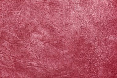 Beautiful red background with leather texture with red veins of red leather background as sample of red background from natural leather or sample of texture of leather for beautiful natural background