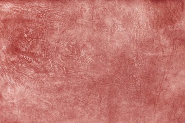Beautiful red background with leather texture with red veins of red leather background as sample of red background from natural leather or sample of texture of leather for beautiful natural background