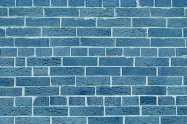 Mavi tuğlalardan yapılmış olağandışı mavi tuğlalar ve soyut mavi arkaplan için kırık mavi tuğlalar olan tuğla duvar.