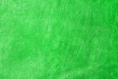 Beautiful green background with leather texture with green veins of green leather background as sample of green background from natural leather or texture of leather for beautiful background
