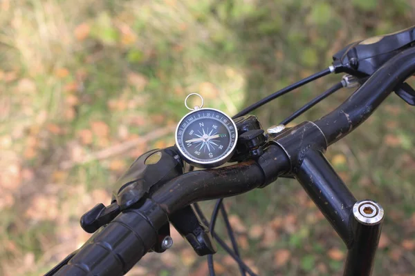 round compass on bicycle wheel as symbol of tourism with compass and travel with compass and outdoor activities with compass