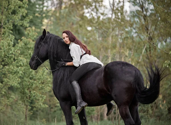 Beautiful Long Haired Girl Riding Friesian Horse — Stock Photo, Image