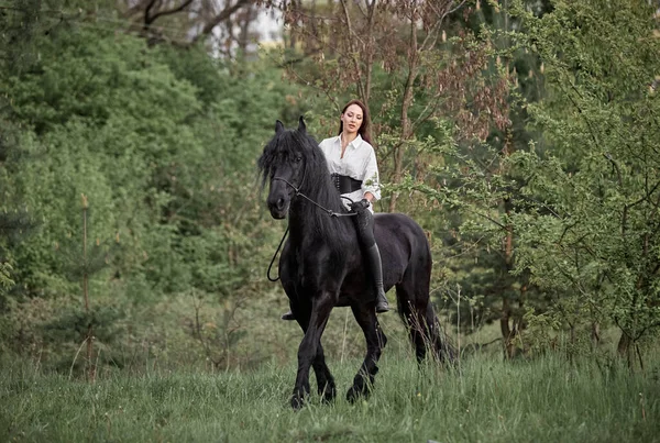 Beautiful Long Haired Girl Riding Friesian Horse — Stock Photo, Image