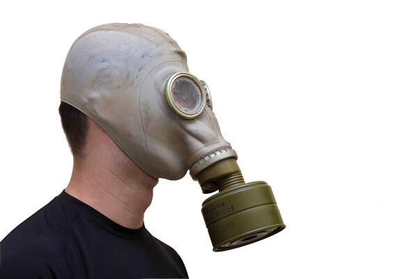 Man with old style gas mask isolated on white background, side v