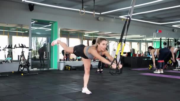 Crossfit Blonde Woman Exercising Stretches Muscles Playing Sports Stretching Trx — Stock Video