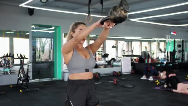 Crossfit Blond Woman Training Kettlebell Stretches Muscles Playing Sports — Stock Video