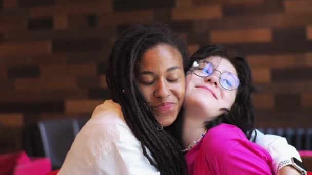 African American Young Mother Her White Daughter Sitting Cafe Talking — Video